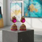 traditional pink stone gold plated jhumka earrings
