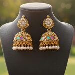 traditional gold tone multicolor stone jhumka earrings with pearl drops