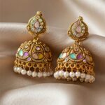 traditional gold tone multicolor stone jhumka earrings with pearl drops