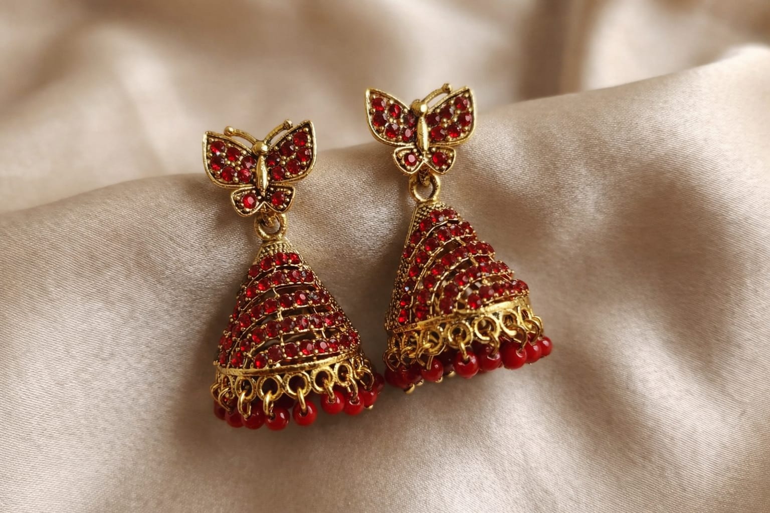 butterfly design stone gold plated jhumka earrings