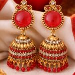 traditional pink stone gold plated jhumka earrings